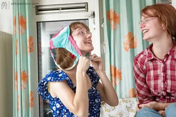 Short-Haired Lesbians in Glasses Lick Hairy Pussies in the Kitchen