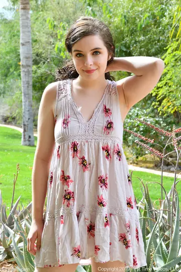 Curly Woman in Lingerie Plays with a Huge Dildo Outdoors