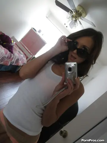 Brunette MILF in Glasses Shows Off Her Ass in a Mirror Selfie