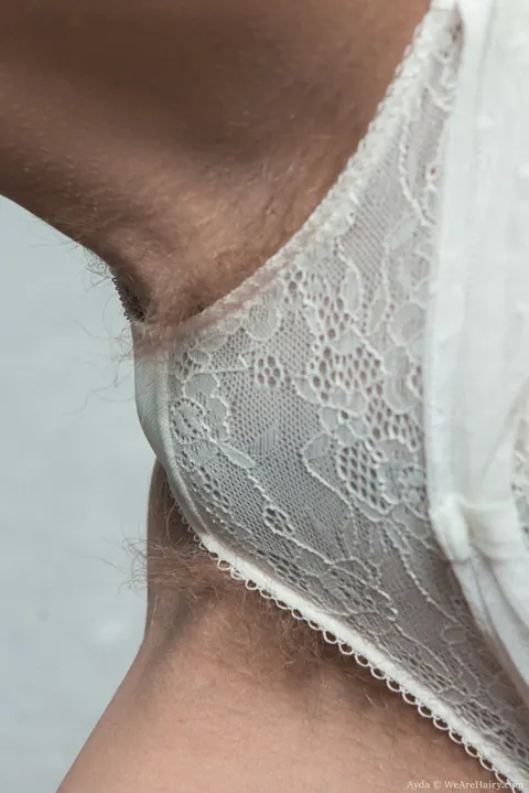 Blonde in Lingerie Pulls Thong Aside to Show Her Hairy Pussy – photo 3 of 16