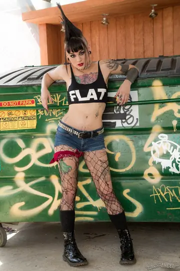 Asian Brunette Pulls Down Her Fishnets to Spread in an Alley