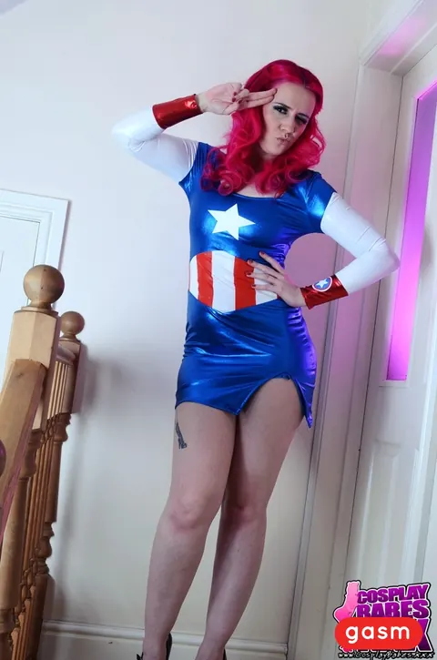 Redhead Poses in Latex Costume and Skirt with High Heels – photo 9 of 15
