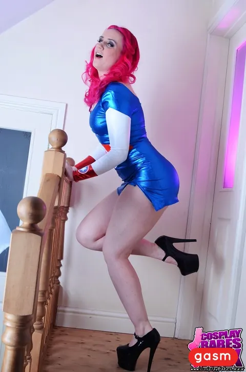 Redhead Poses in Latex Costume and Skirt with High Heels – photo 11 of 15