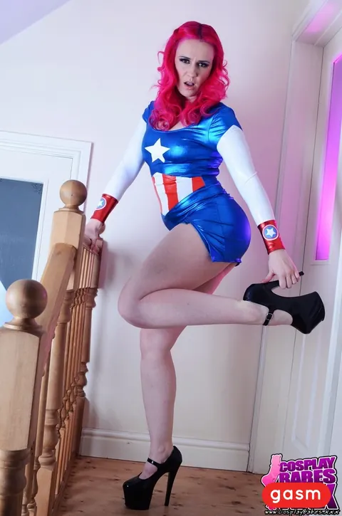 Redhead Poses in Latex Costume and Skirt with High Heels – photo 10 of 15