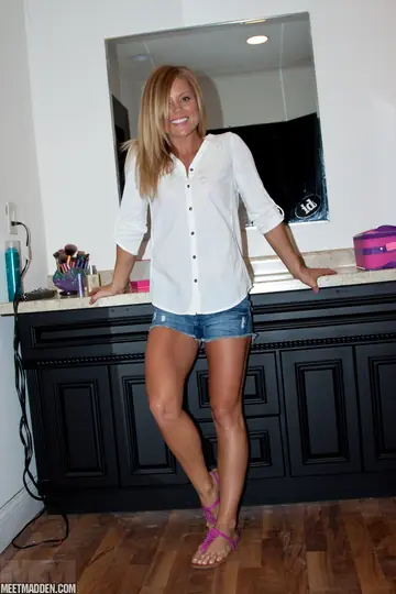 Meet Madden – Slim Blonde MILF Strips Out of Her Shorts to Show Lingerie