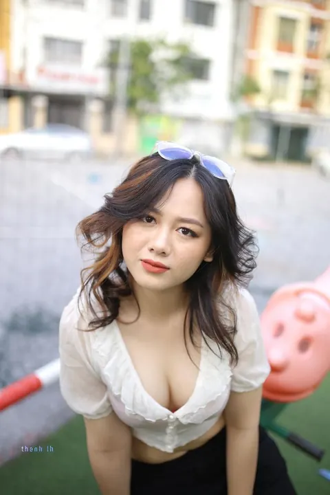 Asian Brunette in Glasses Poses Playfully Outdoors – photo 5 of 21