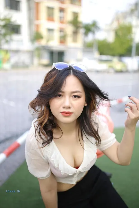 Asian Brunette in Glasses Poses Playfully Outdoors – photo 7 of 21