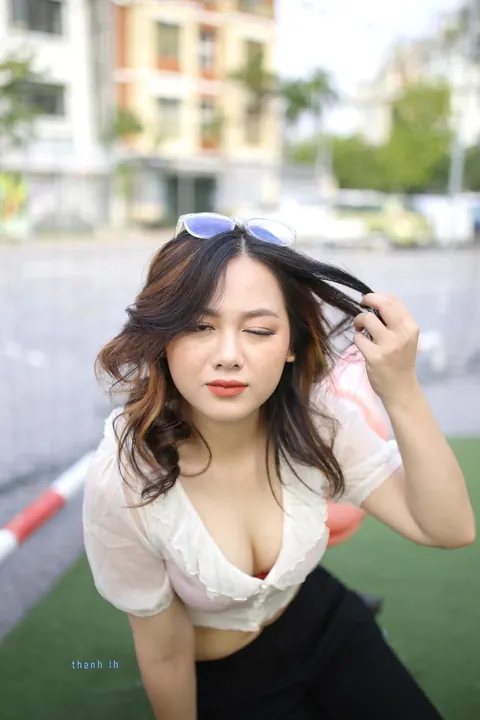 Asian Brunette in Glasses Poses Playfully Outdoors – photo 8 of 21