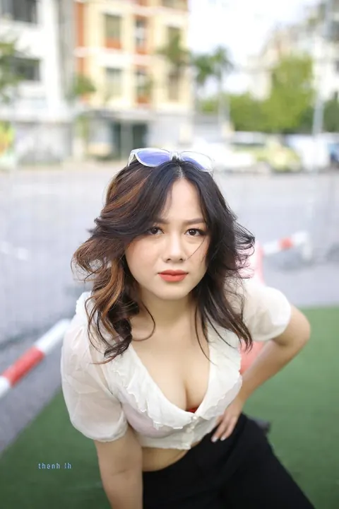 Asian Brunette in Glasses Poses Playfully Outdoors – photo 9 of 21