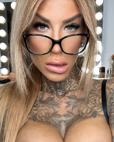 Tattooed Woman Strips and Poses Nude – photo 2 of 10