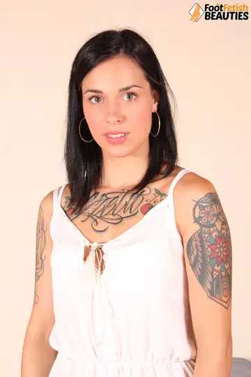 European Brunette in Shorts and Heels Shows Off Her Feet