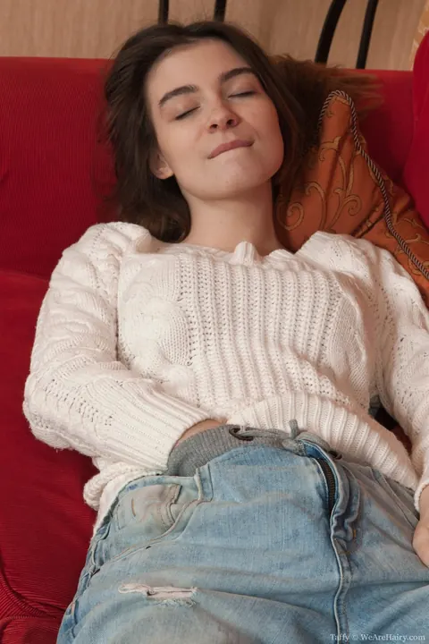 Slim Brunette Fingers Her Hairy Pussy on the Sofa in Socks – photo 3 of 16