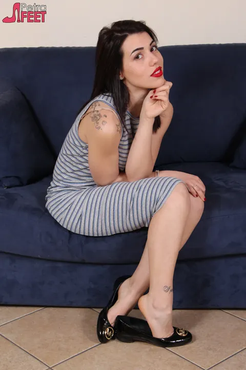 European Brunette Sniffs a Shoe and Shows Her Soles in a Skirt – photo 2 of 10