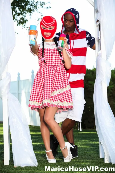 Marica Hase: Asian MILF in a Costume Skirt Fucks a Black Man Outdoors – photo 11 of 12