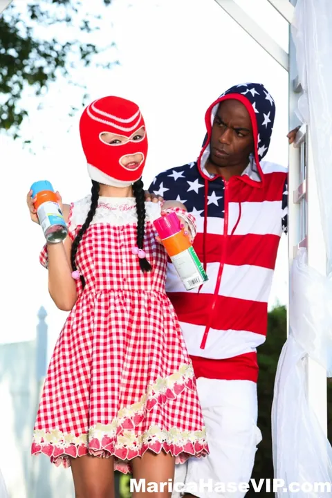 Marica Hase: Asian MILF in a Costume Skirt Fucks a Black Man Outdoors – photo 9 of 12