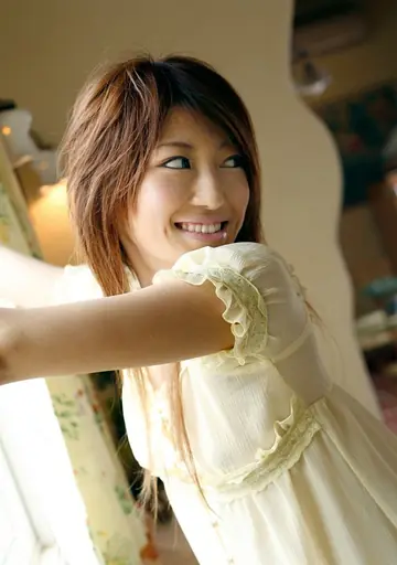 Slim Japanese Redhead Poses in a Skirt and Thong