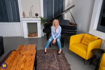 European Blonde MILF Shows Her Curves in Jeans and Heels