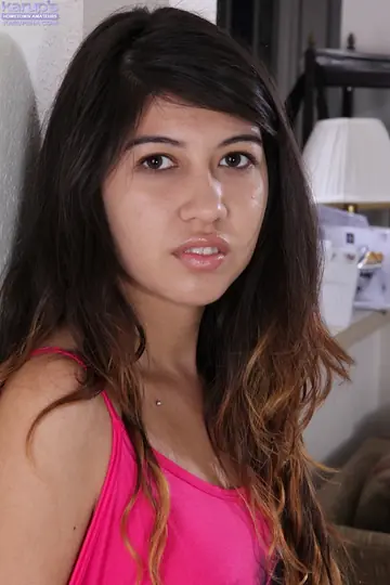 Busty Brunette Undresses and Spreads Her Shaved Pussy in Close-Up