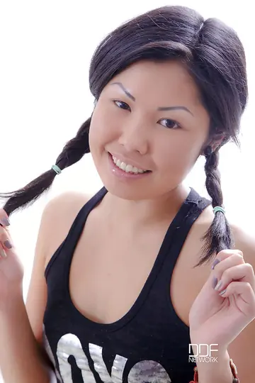 Mira D – Asian Brunette in Pigtails Slips Off Her Socks and Strips to Panties