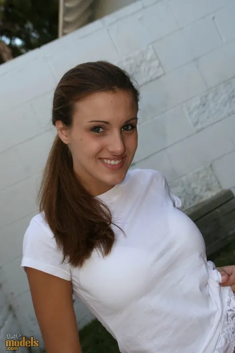 Andie Valentino: Busty Brunette Strips Out of Her Skirt on a Towel Outdoors – photo 1 of 16