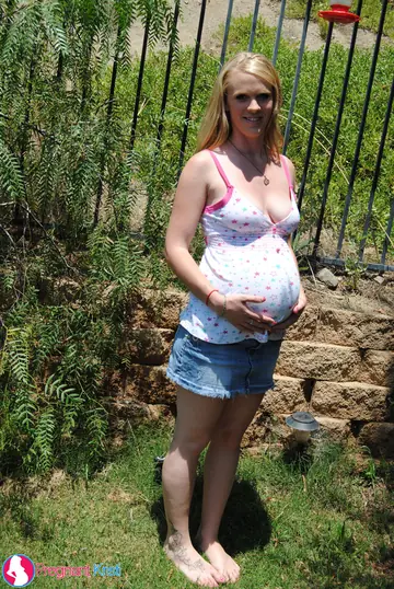 Pregnant Blonde Strips Out of Her Skirt in the Garden