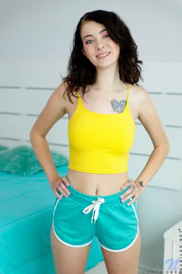 Slim Brunette Strips Out of Her Shorts and Spreads Her Ass on the Bed