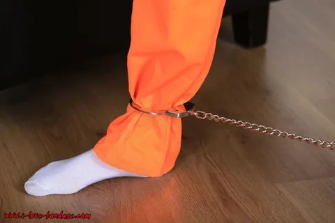 Brunette in Pigtails Spreads Her Legs While Cuffed in an Orange Jumper – photo 5 of 16