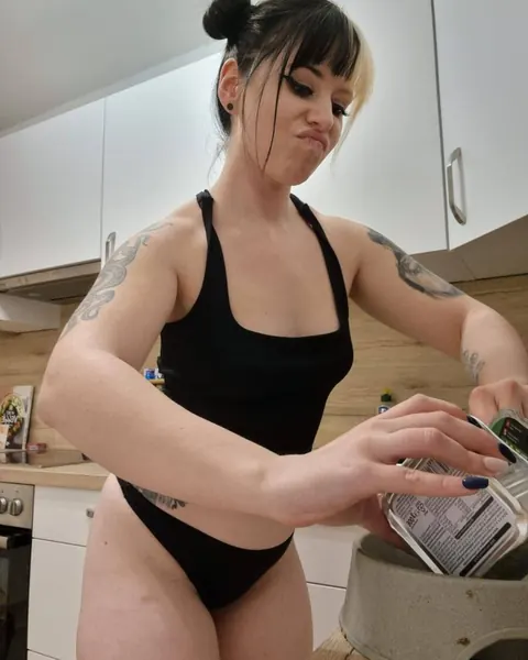 Tattooed Amateur Poses in Panties While Cooking in the Kitchen – photo 4 of 17