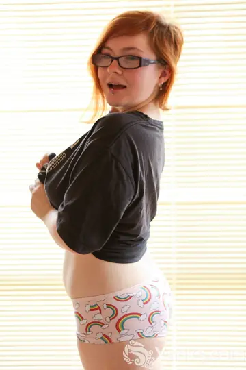 Chubby Redhead in Glasses Fingers Her Hairy Pussy