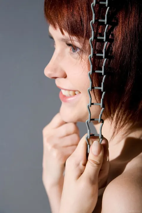 Woman Strips Nude, Arches Back and Turns Slowly for the Camera – photo 16 of 21