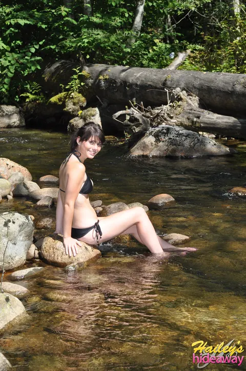 Busty Tattooed Brunette Strips Out of Her Bikini by the River – photo 4 of 12