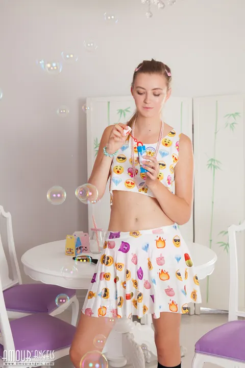 Tafy: Slim Brunette in a Skirt and Pink Socks Blows Bubbles and Strips – photo 2 of 20