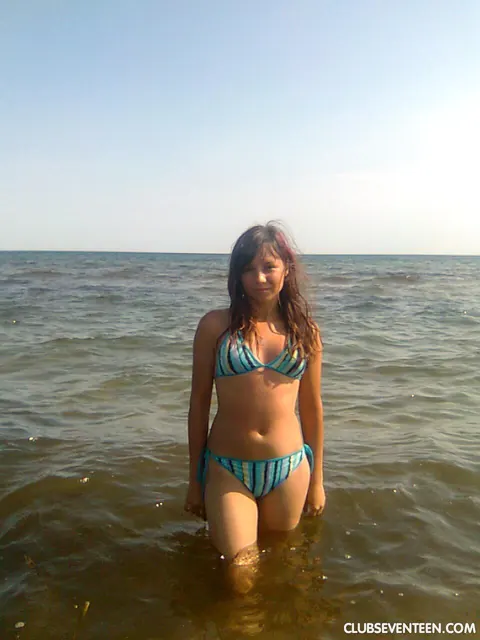Camilla D: Brunette in a Bikini, Denim Shorts and Glasses Poses Outdoors – photo 1 of 20