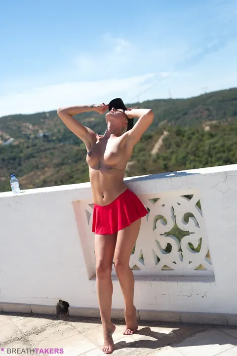 Blonde in Tennis Skirt Shows Her Ass on the Balcony – photo 7 of 12