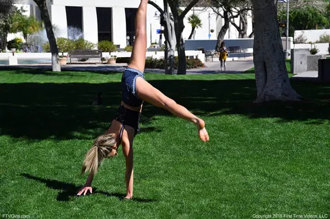 Athena Faris: Skinny Blonde in Jeans and Shorts Does a Cartwheel Outdoors – photo 9 of 20