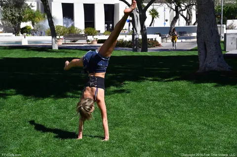 Athena Faris: Skinny Blonde in Jeans and Shorts Does a Cartwheel Outdoors – photo 8 of 20