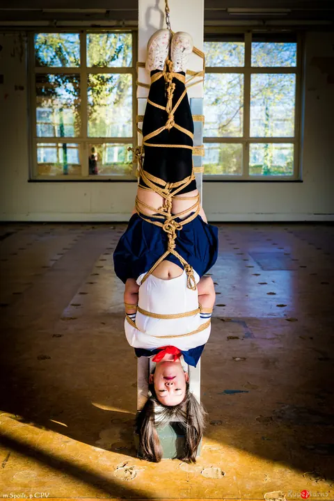 Japanese Woman in Uniform Skirt and Socks Tied Upside Down – photo 15 of 16