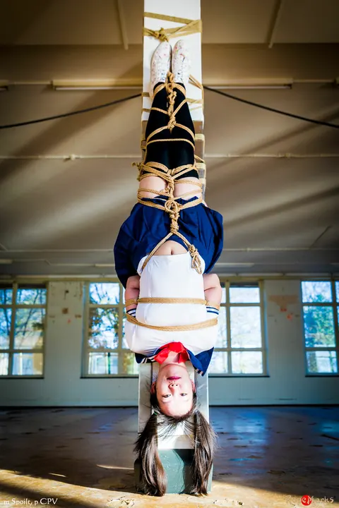 Japanese Woman in Uniform Skirt and Socks Tied Upside Down – photo 9 of 16