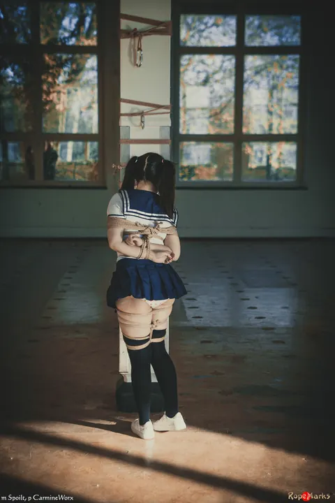 Japanese Woman in Uniform Skirt and Socks Tied Upside Down – photo 2 of 16