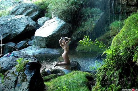Woman with Natural Tits Undresses and Poses in Nature – photo 16 of 20