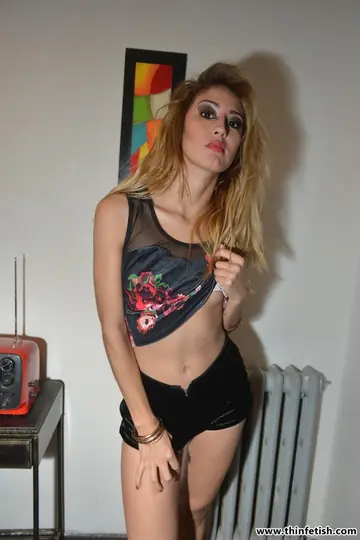 Skinny Blonde Strips Out of Her Shorts and Oils Up