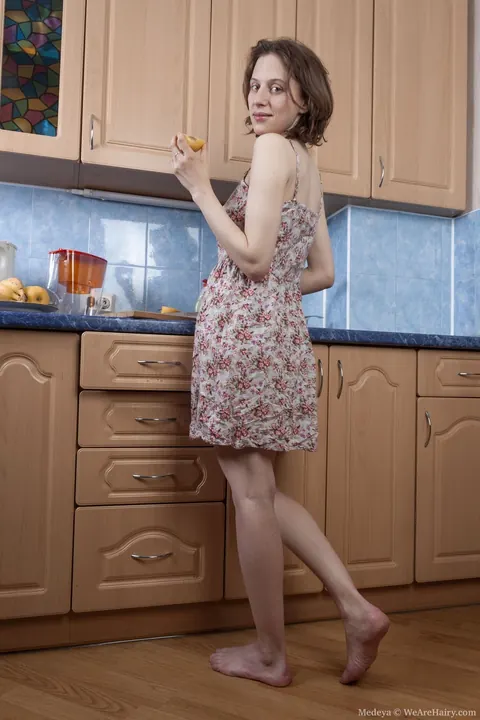 Slim Brunette Strips Out of Her Panties in the Kitchen – photo 2 of 21
