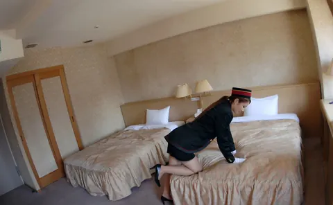 Japanese Redhead in Uniform and Stockings Poses in a Hotel – photo 11 of 16