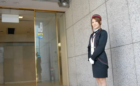 Japanese Redhead in Uniform and Stockings Poses in a Hotel – photo 1 of 16