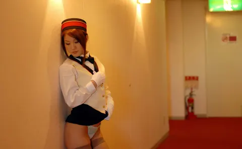 Japanese Redhead in Uniform and Stockings Poses in a Hotel – photo 13 of 16