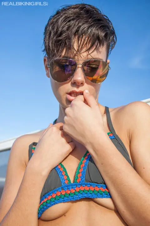 Thick Short-Haired Brunette in a Bikini and Glasses Poses Outdoors – photo 4 of 12