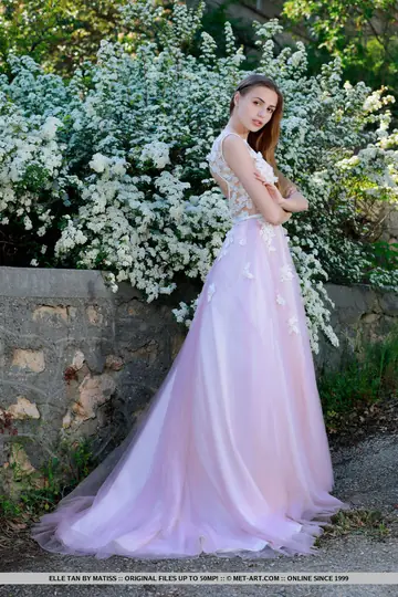 Tall European Brunette Strips Out of Her Wedding Dress in the Garden