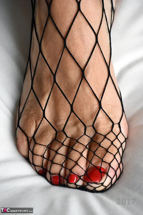 BBW with Big Tits in Fishnet Pantyhose Toys Herself – photo 13 of 20