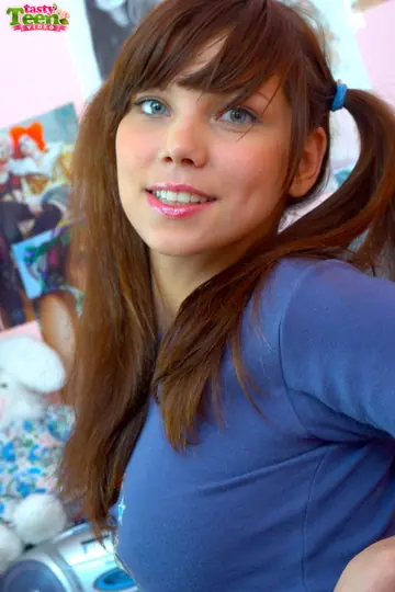 Carla Jessi – Tall Brunette in Pigtails Lowers Pink Fishnets and Fingers Her Pussy