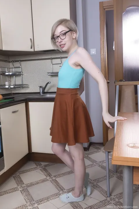 Short-Haired Blonde in Socks and Glasses Spreads in the Kitchen – photo 5 of 21